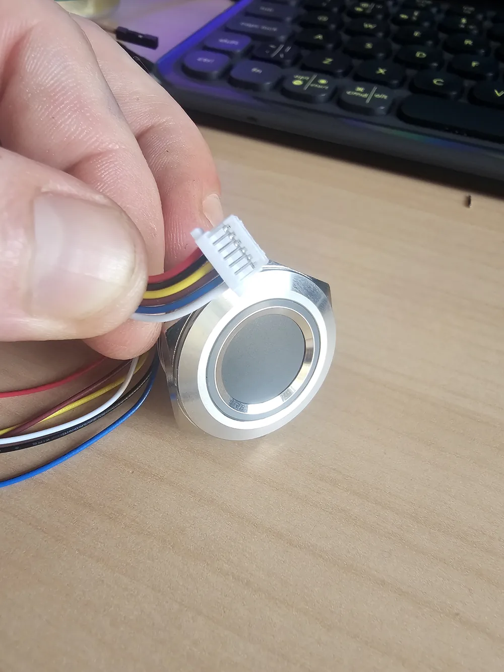 Close-up of the QRelia Pulse fingerprint sensor and LED ring